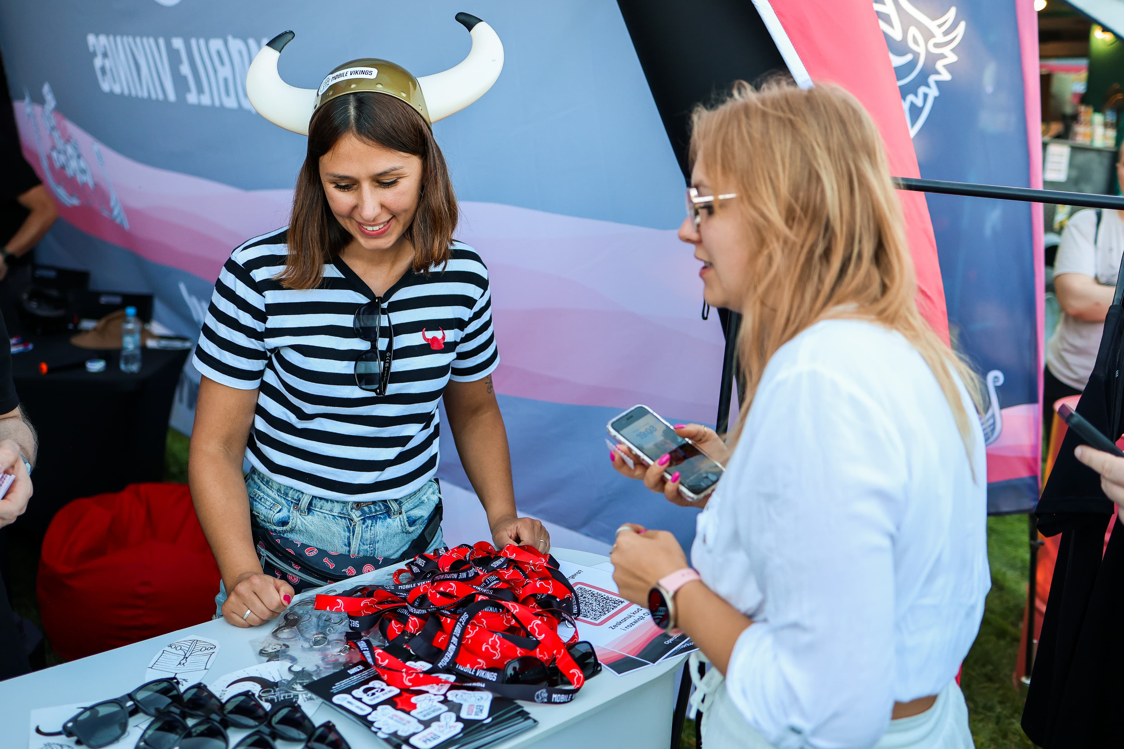 Visitors at the Mobile Vikings festival booth.