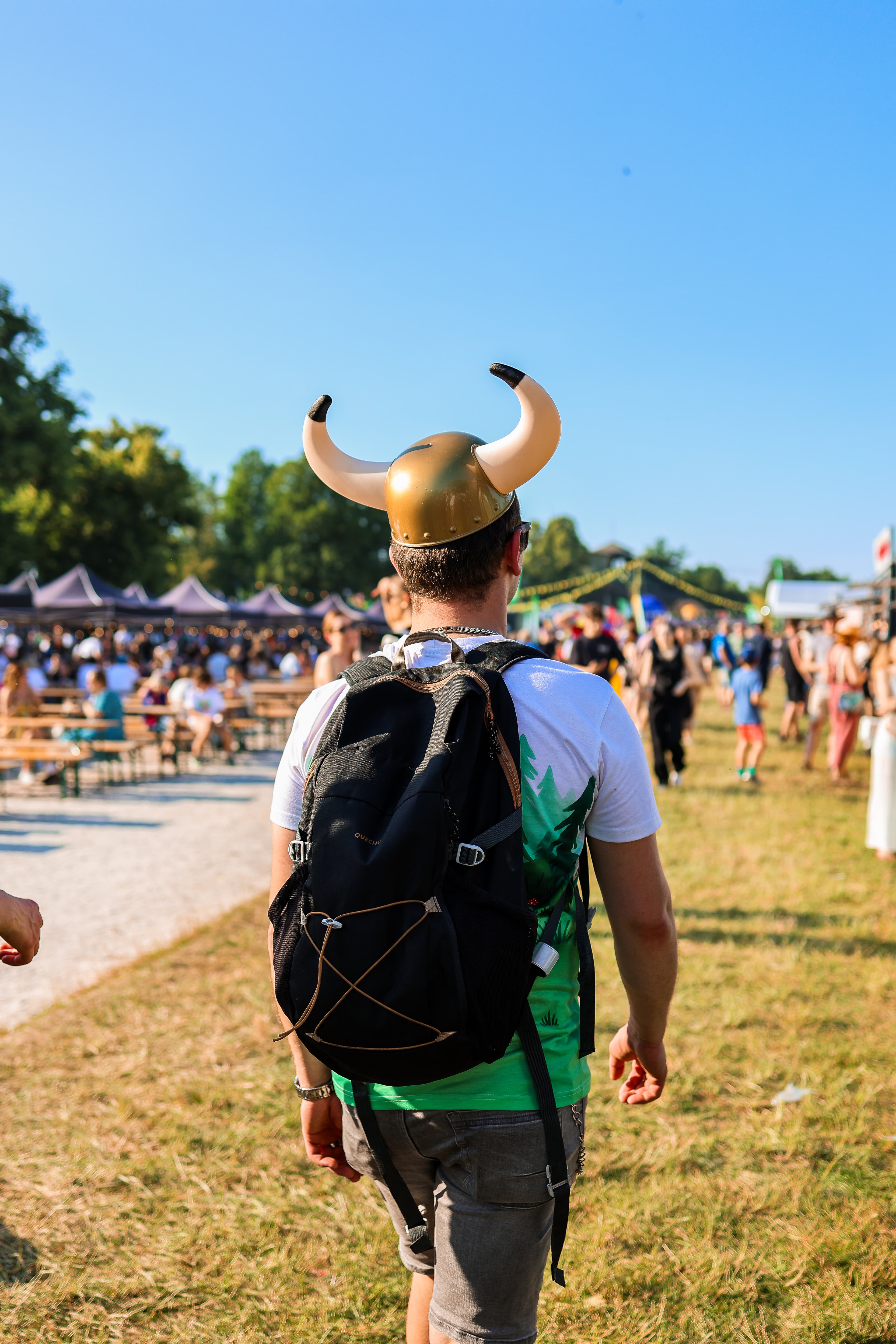 Festival attendee wearing a Viking helmet.