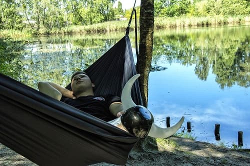 Viking Konrad lies in a Mobile Vikings hammock