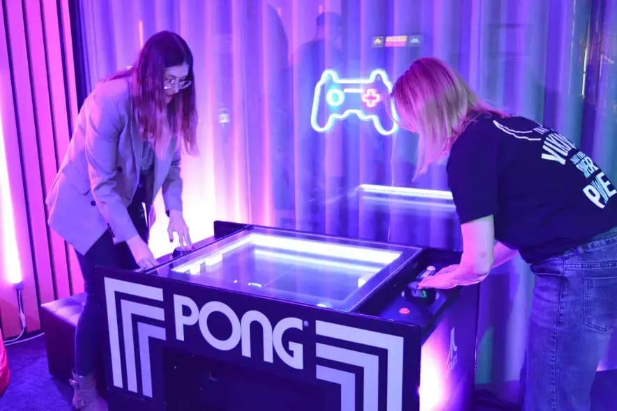 two girls playing pong at mobile vikings birthday
