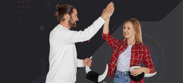 The man and the woman are giving each other a high five