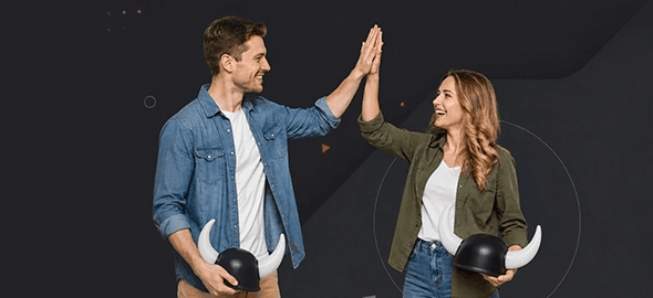 The man and the woman are giving each other a high five